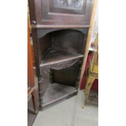 1578 - A carved corner cupboard on stand, COLLECT ONLY.