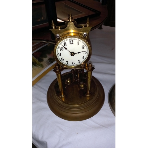 354 - A pair of 1912 German national silver co anniversary clocks for spare or repair