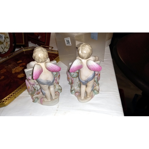 357 - A pair of continental bisque angels menu holders