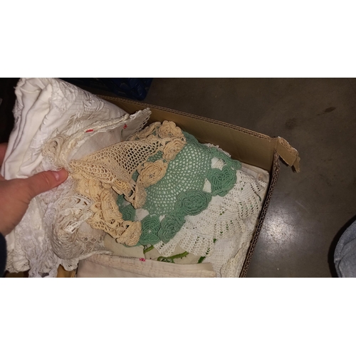 381 - A box of linens and doilies etc