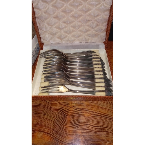 395 - A boxed set of Cavalier silver plated coasters, goblets set, boxed cutlery etc