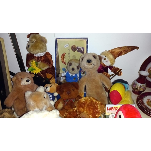 414 - A quantity of soft toys including meerkats etc