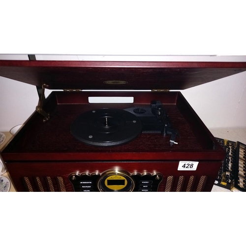 428 - A 20th century record player / radio. COLLECT ONLY.