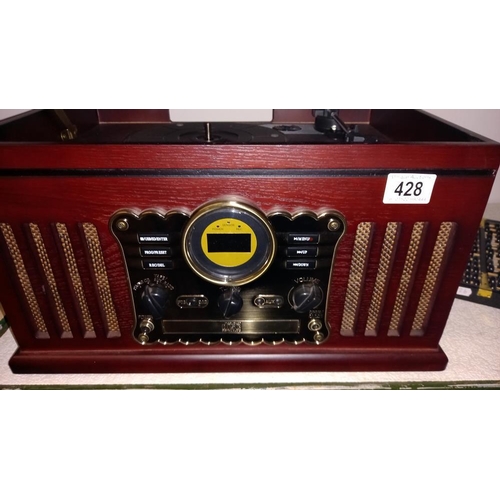 428 - A 20th century record player / radio. COLLECT ONLY.