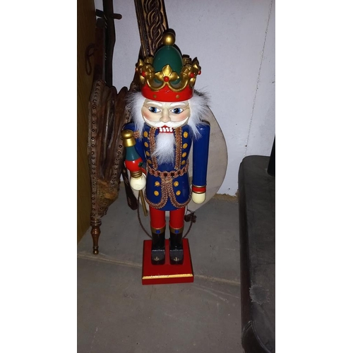 445 - A tourist tribal one string 'guitar', oak bellows and a German soldier nutcracker