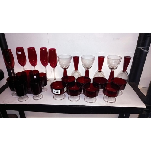 452 - A good lot of red glass including champagne flutes, sundae dishes etc