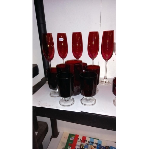 452 - A good lot of red glass including champagne flutes, sundae dishes etc