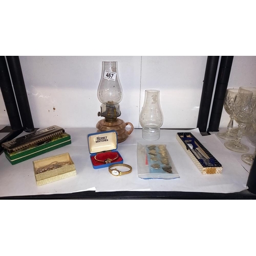 467 - A mixed lot including oil lamp with chimneys, boxed harmonica, watches, RAF tie pin etc