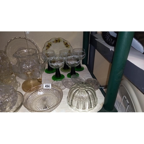 494 - A selection of glass ware including jelly mould, wine glasses etc