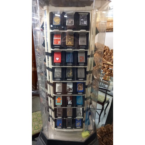 1518 - A Zippo lighters collector's cabinet complete with 100 lighters and magazines. (should revolve but n... 