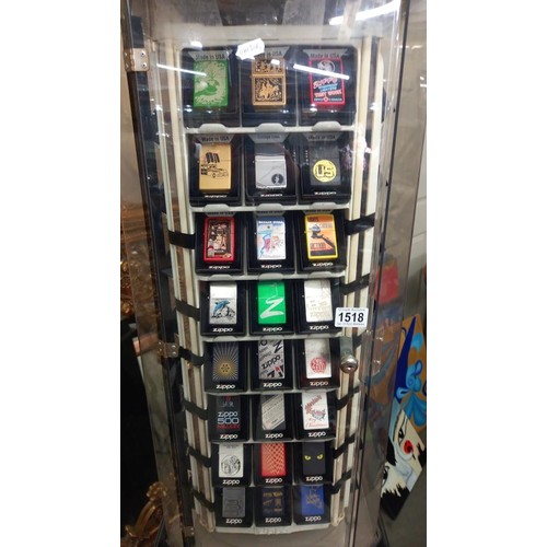 1518 - A Zippo lighters collector's cabinet complete with 100 lighters and magazines. (should revolve but n... 