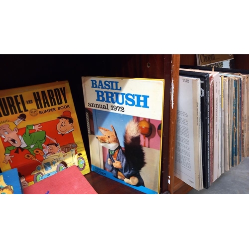 558 - A quantity of annuals including Laurel and Hardy, Basil Brush etc plus quantity of books including E... 