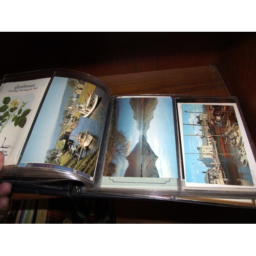 560 - 2 albums of postcards etc