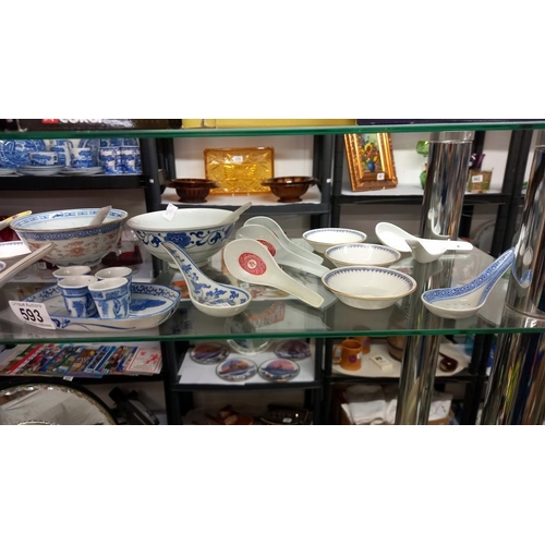 593 - A quantity of Chinese rice/soup bowls and spoons etc