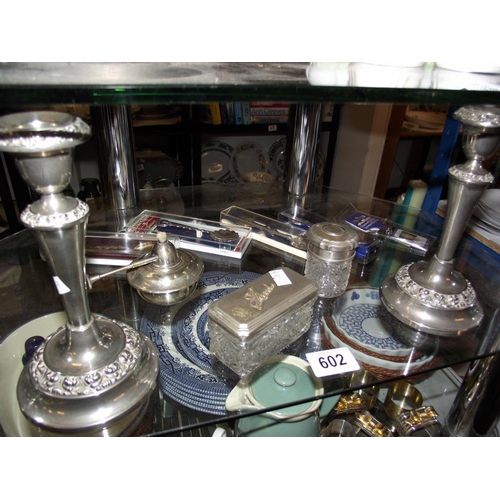 602 - Silver plated candlesticks, trinket pots, & spoons