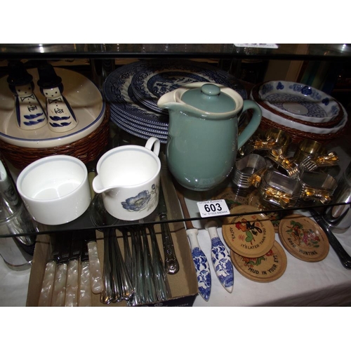 603 - A quantity of kitchenalia including blue and white places, cutlery, napkin rings etc