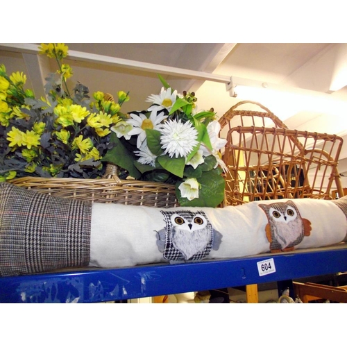 604 - A wicker basket with faux flowers, magazine rack and owl draught excluder