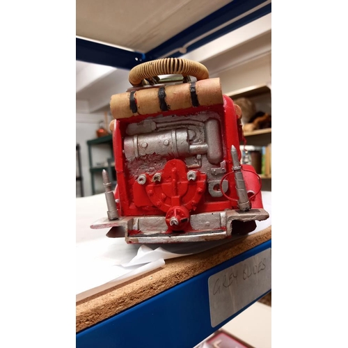 683 - A large pressed steel and fibre glass model of a vintage American fire engine length 36cm