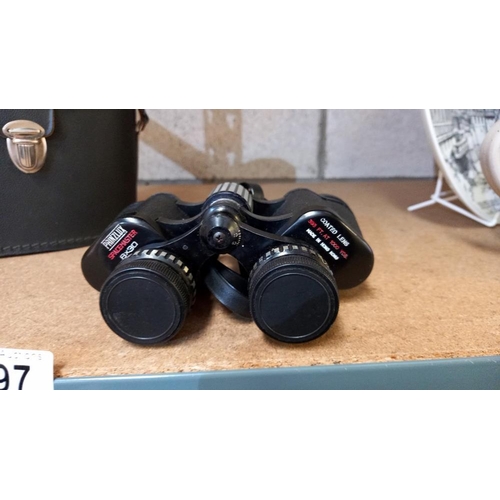 697 - A cased set of Prinzlux 8 x 30 binoculars