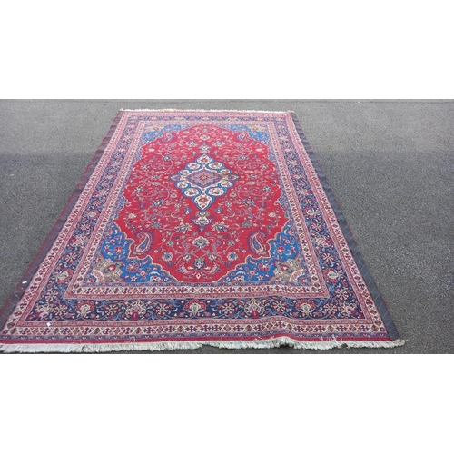 771 - A red patterned rug, 128