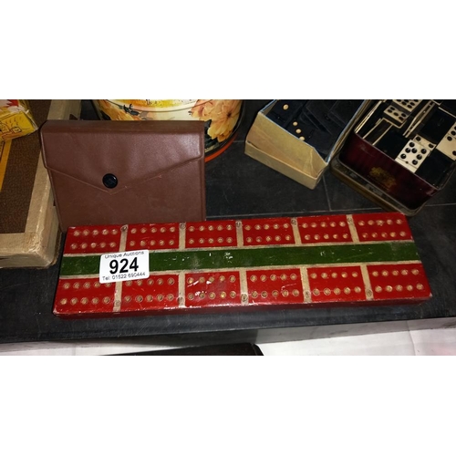 924 - A quantity of games including cribbage board