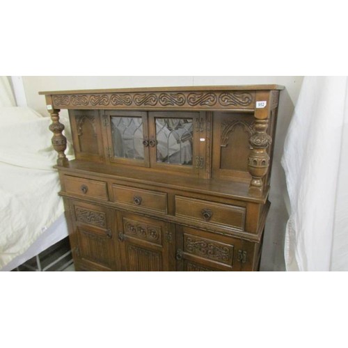 952 - A carved oak buffet sideboard. COLLECT ONLY.