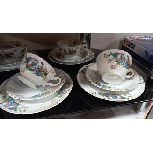 25 - An 18 piece tea set decorated with Geisha girls