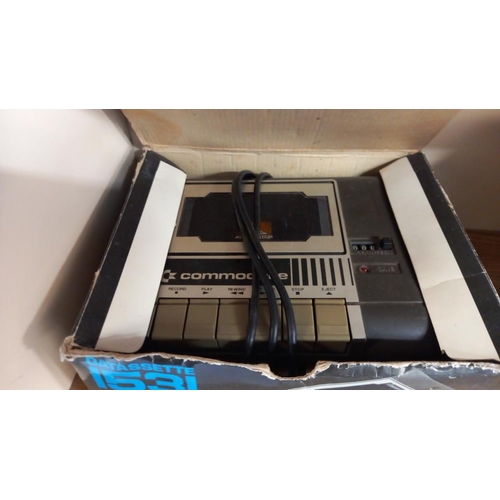 86 - 2 boxed commodore datassette cassette players and a Hanimex Hanorama slide viewer