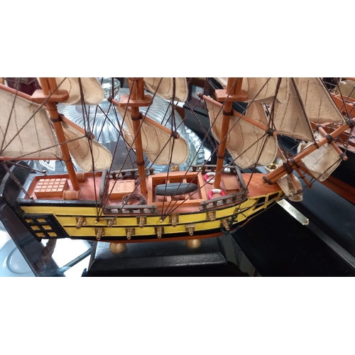 96 - A detailed wooden model of a sailing ship titled 'Atlantic' on stand, Length 82cm, height 68cm & 1 o... 