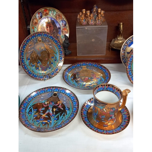 111 - A set of 8 Royal Worcester Legends of the Nile collectors plates, mugs and saucers, Egyptian items e... 