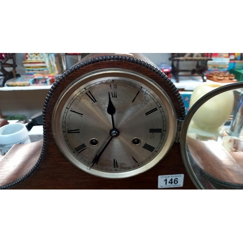 146 - A 1930's oak mantle clock