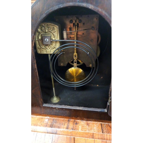 146 - A 1930's oak mantle clock