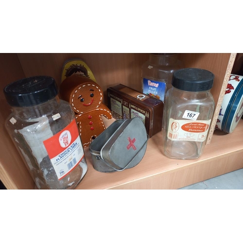 167 - A good selection of tins, vintage sweet shop bottles/jars and a pottery gingerbread man biscuit hold... 