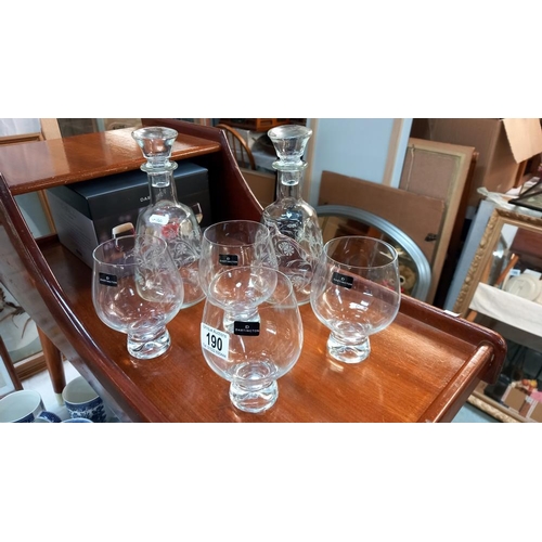 190 - A boxed set of 4 Dartington glasses and 2 decanters