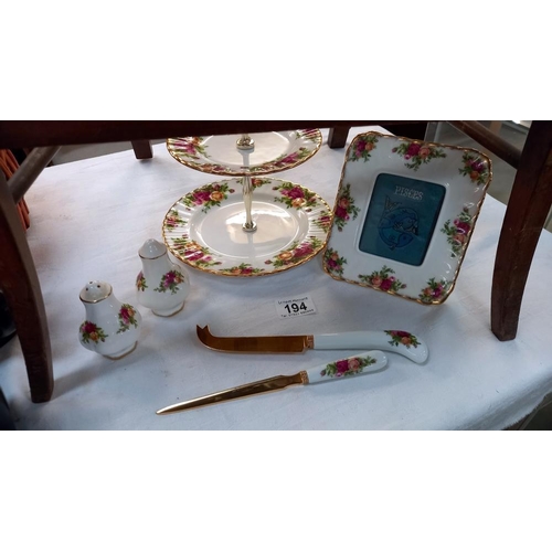 194 - A Royal Albert Old Country Rose 2 tier cake stand, photo frame, cheeses knife, letter opener and sal... 