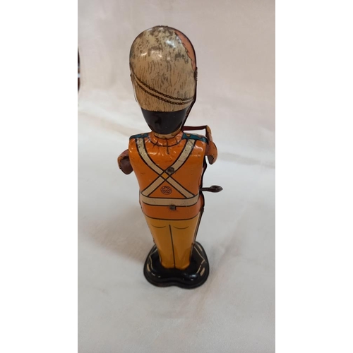 208 - Vintage tinplate clockwork Marx toys George the drummer boy and painted wood Grenadier guard skittle