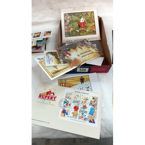 229 - A quantity of Rupert the Bear stamps etc including ingot puzzle game etc