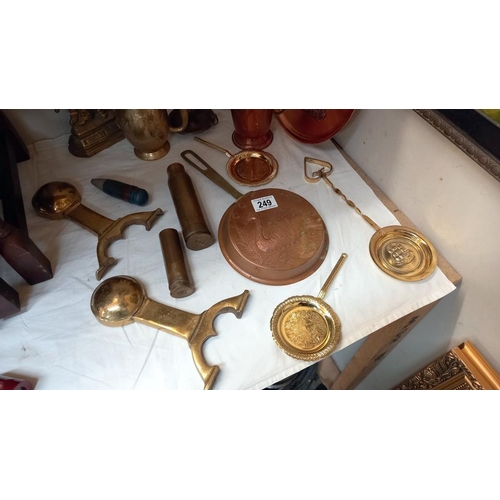 249 - A selection of brass & copper including Britain's Pride Sailor door stops & shell cases etc. COLLECT... 