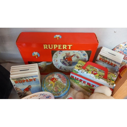 257 - A good selection of Rupert The Bear collectables including pottery, books & glove puppet etc. COLLEC... 