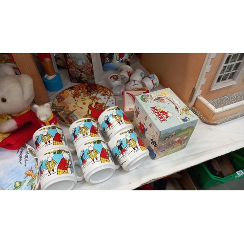 257 - A good selection of Rupert The Bear collectables including pottery, books & glove puppet etc. COLLEC... 