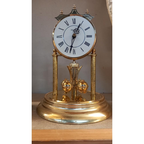 269 - 2 Anniversary clocks small one under plastic dome, large one under glass dome COLLECT ONLY