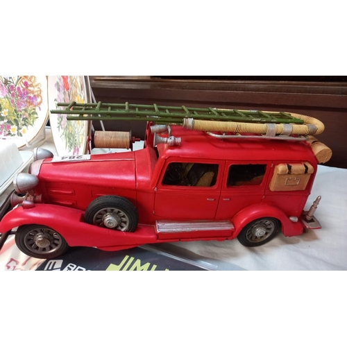 284 - A large pressed steel and fibre glass model of a vintage American fire engine length 36cm