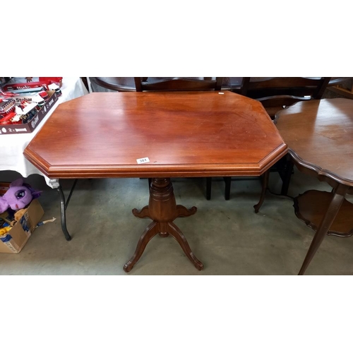 301 - An octagonal mahogany tea table on centre column, 92cm x 61cm x 78cm high, COLLECT ONLY