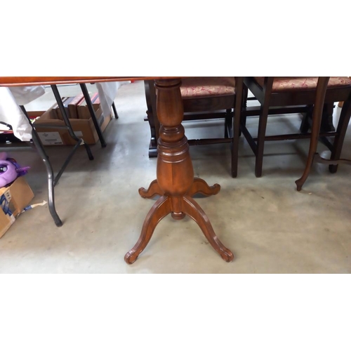 301 - An octagonal mahogany tea table on centre column, 92cm x 61cm x 78cm high, COLLECT ONLY