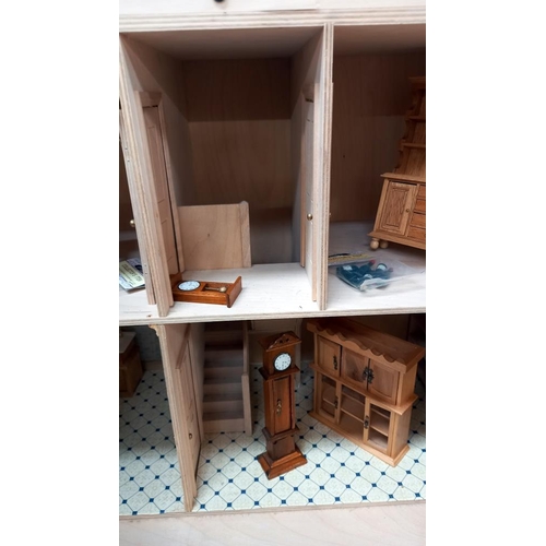 335 - A part built dolls house with few items of furniture COLLECT ONLY