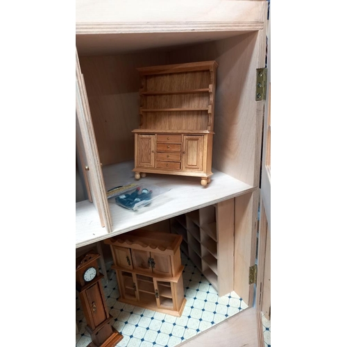 335 - A part built dolls house with few items of furniture COLLECT ONLY