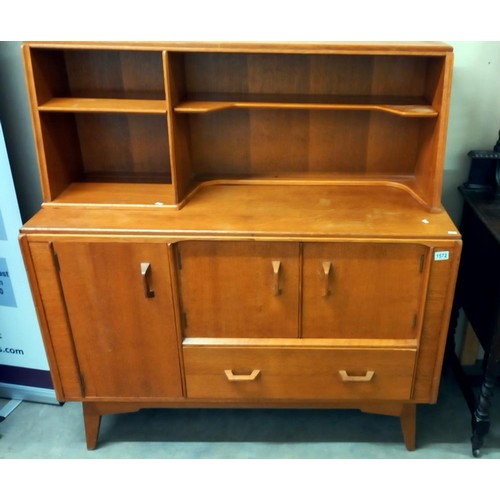 1572 - A 1950's light oak wall unit/sideboard with cupboard/drawer base with sliding cutlery tray & open ra... 