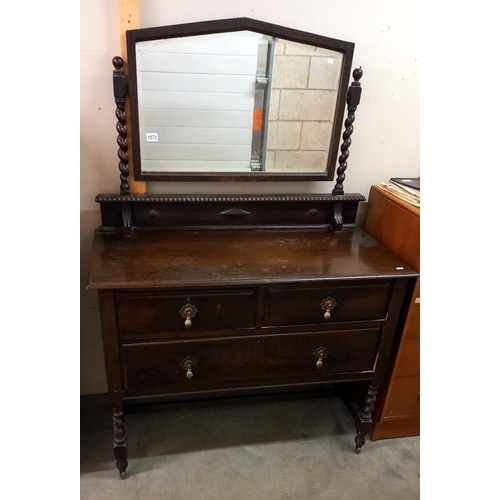 1573 - A 1930's oak mirror back dressing table. 107cm x 50cm x 82cm high, mirror 153cm