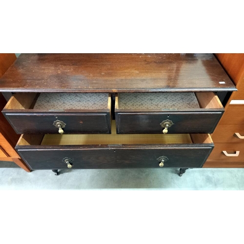 1573 - A 1930's oak mirror back dressing table. 107cm x 50cm x 82cm high, mirror 153cm