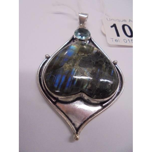 1001 - A large silver and quartz art nouveau style pendant.